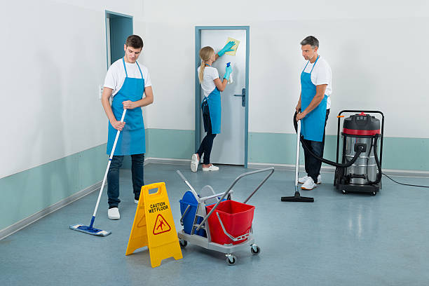 Janitors Cleaning Corridor Group Of Janitors Cleaning Corridor With Cleaning Equipments office cleaning stock pictures, royalty-free photos & images