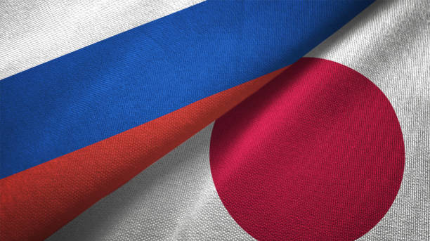 Japan and Russia two flags together realations textile cloth fabric texture stock photo