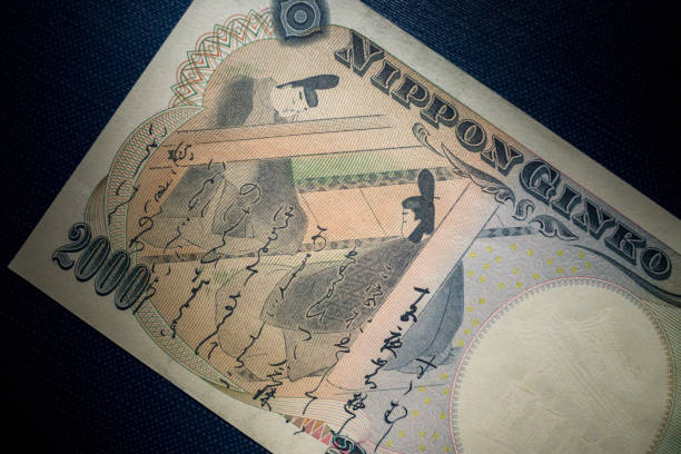 Japanese 2000 yen bill in the light Japanese 2000 yen bill in the light BANK OF JAPAN   stock pictures, royalty-free photos & images