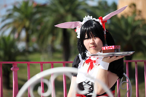 Japanese anime character cosplay girl Marugame, Kagawa, Japan -  Sept 28, 2014: Young japanese girl dressed in cosplay costume at Reoma World Park. photo taken in Reoma World Park during a meeting of cosplayer. french maid outfit stock pictures, royalty-free photos & images