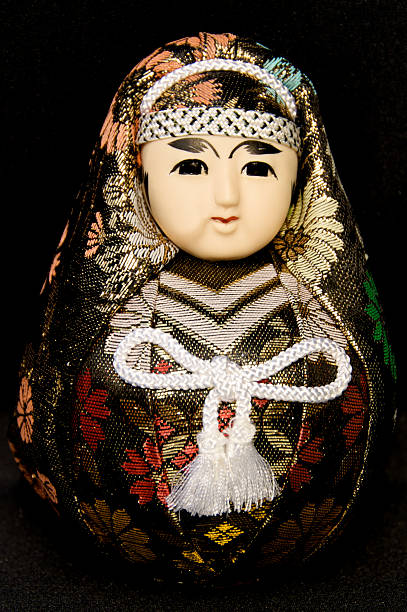 Japanese Doll on Black Background stock photo