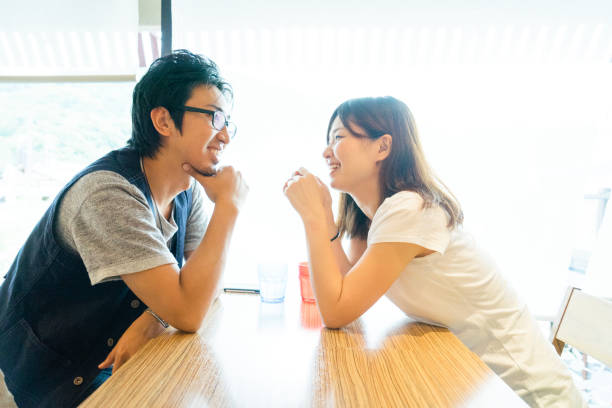 Japanese friend having good time in a cafe stock photo