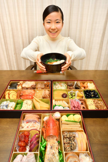 japansk flicka har nyårsfest hemma - new years dinner table bildbanksfoton och bilder