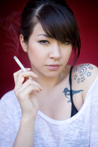 smoking Asian cigar women