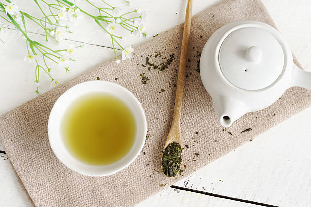 Japanese green tea Japanese green tea on white wooden table green tea stock pictures, royalty-free photos & images