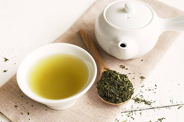 Japanese green tea Japanese green tea on white wooden table green tea stock pictures, royalty-free photos & images