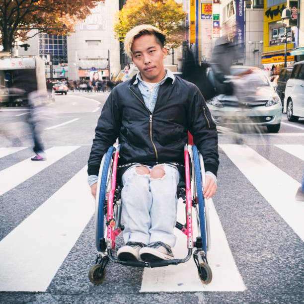 japanese man in wheelchair - wheelchair street imagens e fotografias de stock