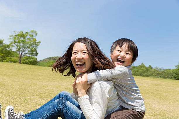 Japanese mother and child Japanese mother and child playing in the park housewife stock pictures, royalty-free photos & images