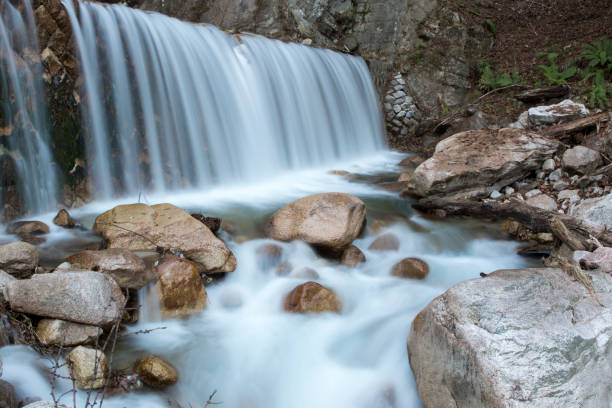 Japanese Mountain Stream Long exposure gives sense of motion in this Japanese Mountain Stream erik trampe stock pictures, royalty-free photos & images