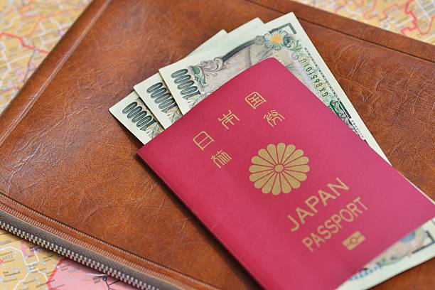 Japanese Passport And Money Japanese Passport And Money japan visa stock pictures, royalty-free photos & images