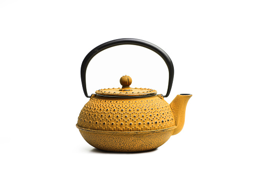 A yellow japanese teapot