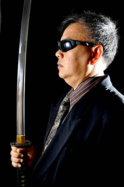 Japanese Yakuza with samurai sword  vudhikrai stock pictures, royalty-free photos & images