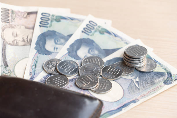 Japanese yen banknotes management for exchange and trading. Manage salaries, income, and expenses to be balanced. Financial, investment, and saving money after retirement concepts. stock photo