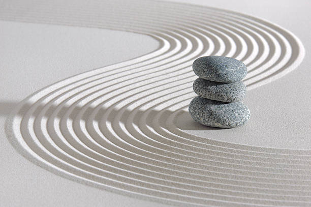 Japanese ZEN garden Japan garden with three white stacked stones in white textured sand buddhism stock pictures, royalty-free photos & images
