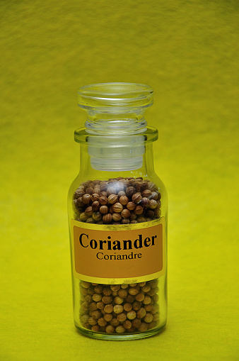 Download A Jar Filled With Coriander On A Yellow Background Stock Photo Download Image Now Istock Yellowimages Mockups
