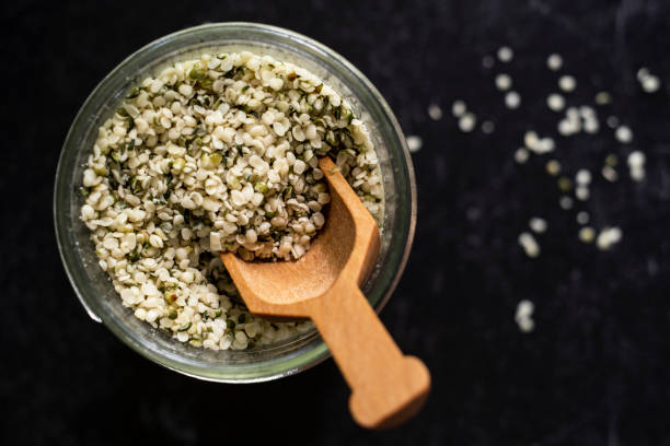 Jar Filled with Hemp Seeds from Above with Scoop stock photo
