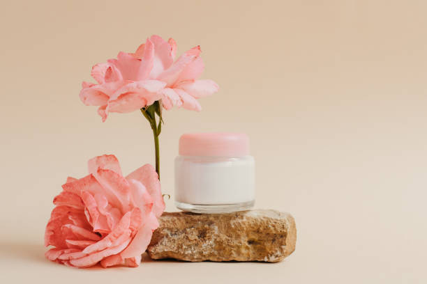 A jar of face or eye skin care cream on a piece of stone with rose flowers. The concept of natural cosmetics from natural materials, purity and tenderness. Copy space A jar of face or eye skin care cream on a piece of stone with rose flowers. The concept of natural cosmetics from natural materials, purity and tenderness. Copy space. rose flower photos stock pictures, royalty-free photos & images