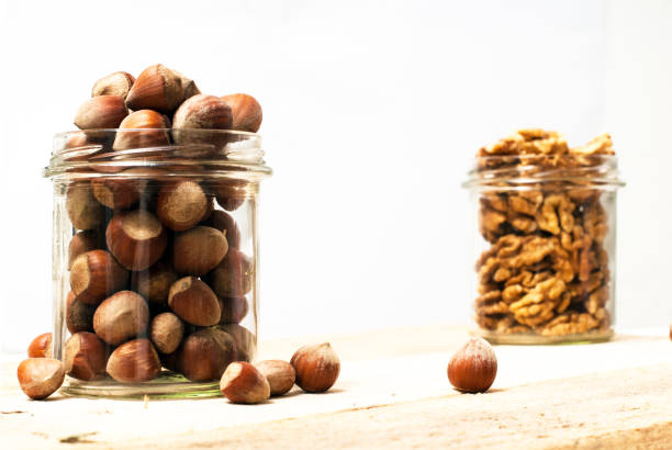 Jar of hazelnuts stock photo