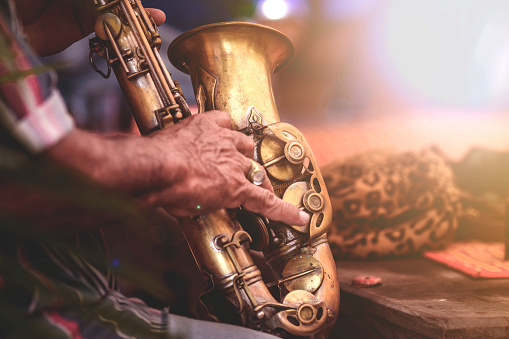 Musical instruments ,Saxophone Player hands Saxophonist playing jazz music. Alto sax musical instrument closeup
