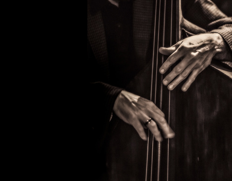 Jazz musician playing the double bass.
