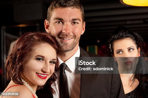 istock Jealous Woman In Background Of Couple's Photo 513393938