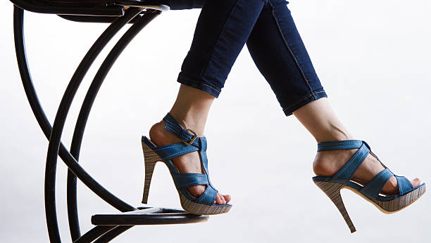 Jeans and high heeled shoes stock photo