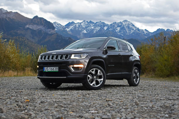 Jeep Compass on the rocky square Zdiar, Slovakia - 5th October, 2017 - Second generation of a Jeep Compass on the rocky square. The American SUV features a choice of few 4x4 systems. This vehicle is used to get in extremely hard areas, for example on the mountain roads. sports utility vehicle stock pictures, royalty-free photos & images