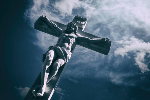 Jesus Christ on the cross A sculpture of Jesus Christ on the cross against a dramatic sky. the crucifixion stock pictures, royalty-free photos & images