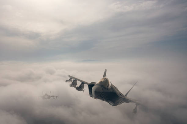 jet aircrafts flying over the clouds. - f 35 imagens e fotografias de stock