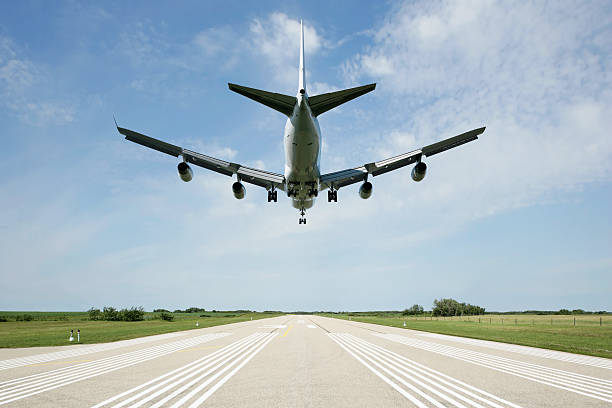 XXL jet airplane landing on runway stock photo