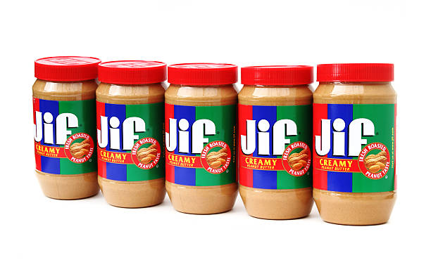 Jif Creamy Peanut Butter West Palm Beach, USA - October 31, 2011: This is a studio product shot showing a row of five Jif Creamy Peanut Butter containers. Jif is made by J.M. Smucker Company. jif stock pictures, royalty-free photos & images