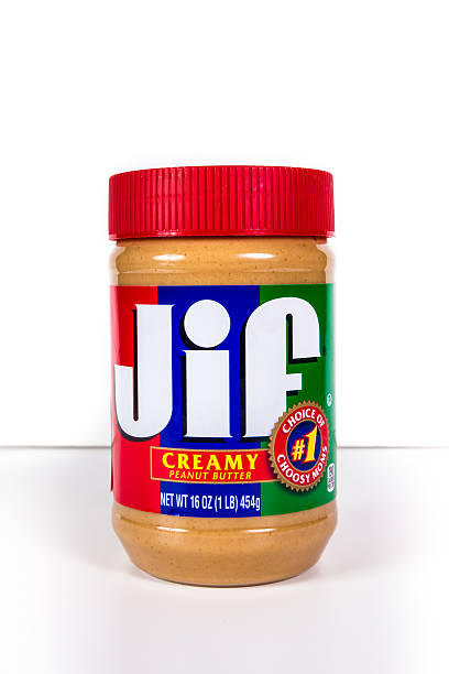 Jif Creamy Peanut Butter New York City, New York, USA - July 9, 2015: Jar of Jif creamy peanut butter against a white background. If is an American brand of peanut butter made my J.M. Smucker Company.  It has been the leading selling brand of peanut butter in the USA since 1981.  jif stock pictures, royalty-free photos & images