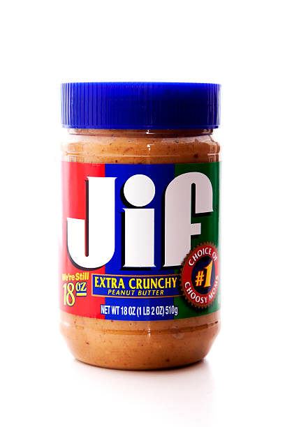 Jif Extra Crunchy Peanut Butter Chula Vista, USA - January 14, 2012: Jif Extra Crunchy Peanut Butter in an 18 oz. plastic jar. jif stock pictures, royalty-free photos & images
