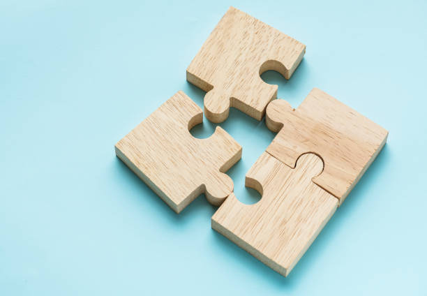 Jigsaw teamwork concept macro shot Jigsaw teamwork concept macro shot business relationship stock pictures, royalty-free photos & images