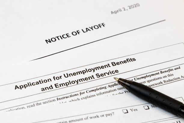 Job layoff notice and application for unemployment insurance benefits paperwork. Concept of Covid-19 coronavirus and stay at home order impact on economy background, no people unemployment stock pictures, royalty-free photos & images