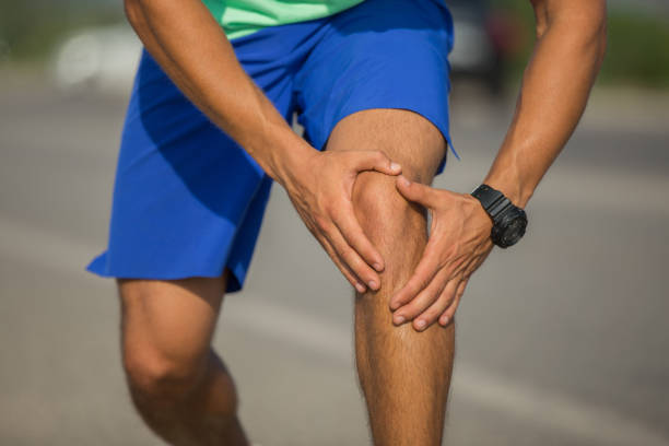 Jogging Injury Jogging Injury human knee stock pictures, royalty-free photos & images