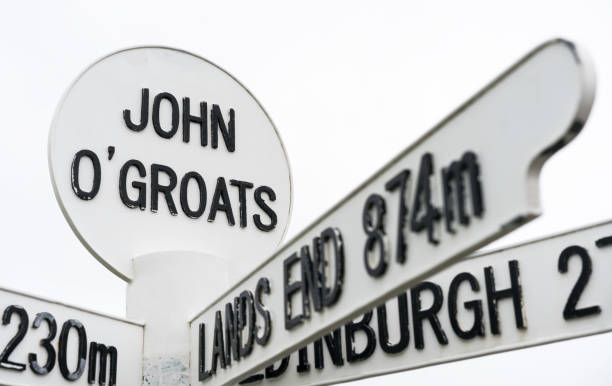 John o'Groats village sign in the north of Scotland with distance to Lands End in the south of England A sign at the Scottish village of John o'Groats.  The village is located at the northeastern tip of Britain, and is often used as the start of end of a trip between the village at the top of Scotland, and Lands Ends, at the south west of England. caithness stock pictures, royalty-free photos & images