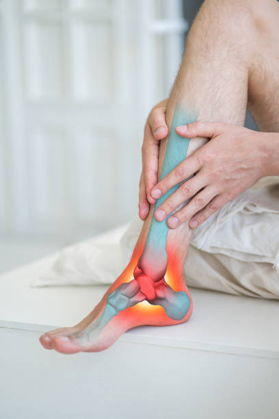 Joint inflammation, foot pain, man suffering from feet ache at home, podiatry concept Joint inflammation, foot pain, man suffering from feet ache at home, podiatry concept, painful area highlighted in red plantar fasciitis stock pictures, royalty-free photos & images