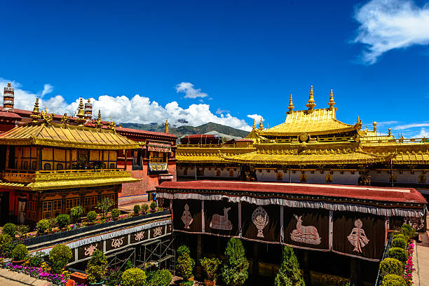 Jokhang Temple The Jokhang Temple in Lhasa, Tibet of China under the morning sunshine. tibet stock pictures, royalty-free photos & images