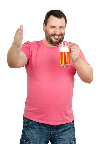 Jolly man toasting with light beer mug stock photo