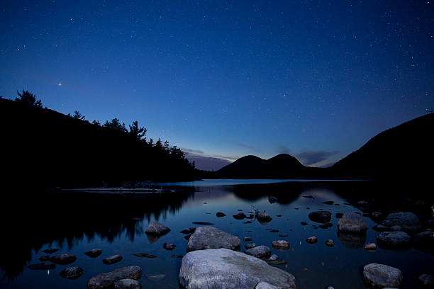 Jordan pond in Acadia National Park with night stars stock photo