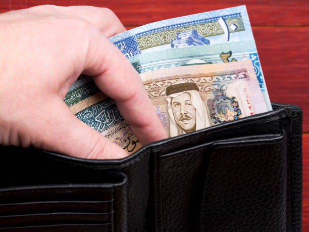 Jordanian money in the black wallet stock photo