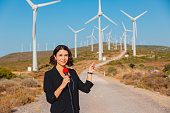 istock Journalist conducting interview of renewable energy in wind turbine. Journalism industry, live streaming concept. 1322827381