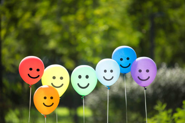 joyful balloon family. joyful balloon family. smiley face stock pictures, royalty-free photos & images