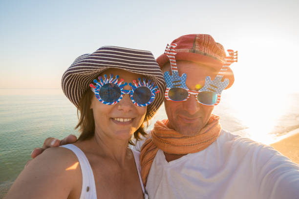 joyful-couple-of-travelers-in-funny-sunglasses-taking-selfie-picture-id?k=&m=&s=x&w=&h=wGJWESFhfuigNwaCqJglzHcHXX_WLRAGO_TQ=