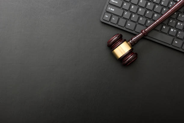 Judge gavel with computer keyboard. Concept of internet crime. Copy space for text stock photo