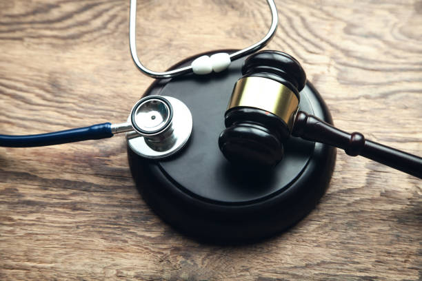 Judge gavel with stethoscope. Medical law Judge gavel with stethoscope. Medical law Injury Lawyer stock pictures, royalty-free photos & images