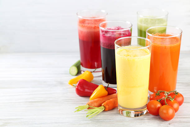 juices juices vegetable juice stock pictures, royalty-free photos & images
