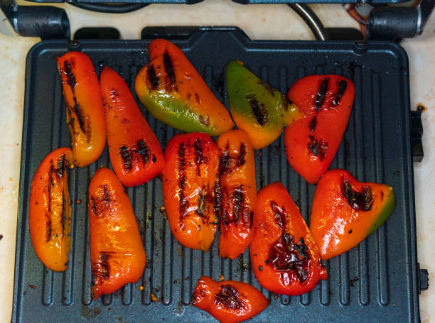 juicy red pepper made on an electric grill, close-up stock photo