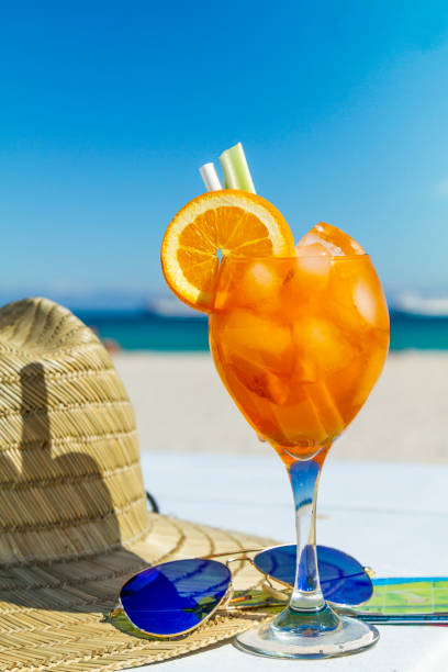 Juicy refreshing alcoholic cocktail served in a sunny day in front of Atlantic Ocean near to Ocean Drive at the most famous beach in South Beach, Miami Beach, Miami, South Florida, United States of America. stock photo
